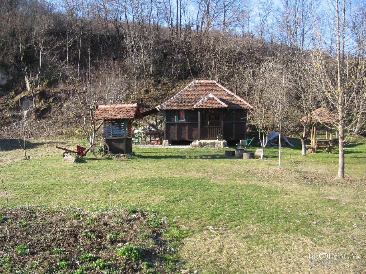 Traditional wooden cottage on the banks of the Gradac river